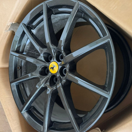 Ferrari 296 carbon fiber wheel close-up in shipping box